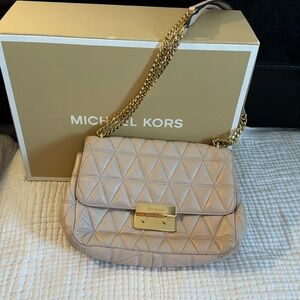 Michael Kors soft pink handbag with gold tone hardware